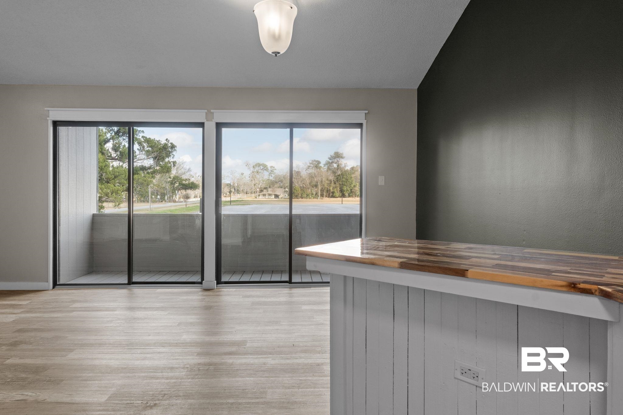 128 West Satsuma Avenue, Unit 128 Foley, AL 36535 - Photo 12 of 41 Kitchen with wooden counters and light wood finished floors