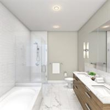 10 Shipyard Drive, Unit 511 Hingham, MA 02043 - Photo 4 of 6 a spacious bathroom with a granite countertop tub sink and mirror