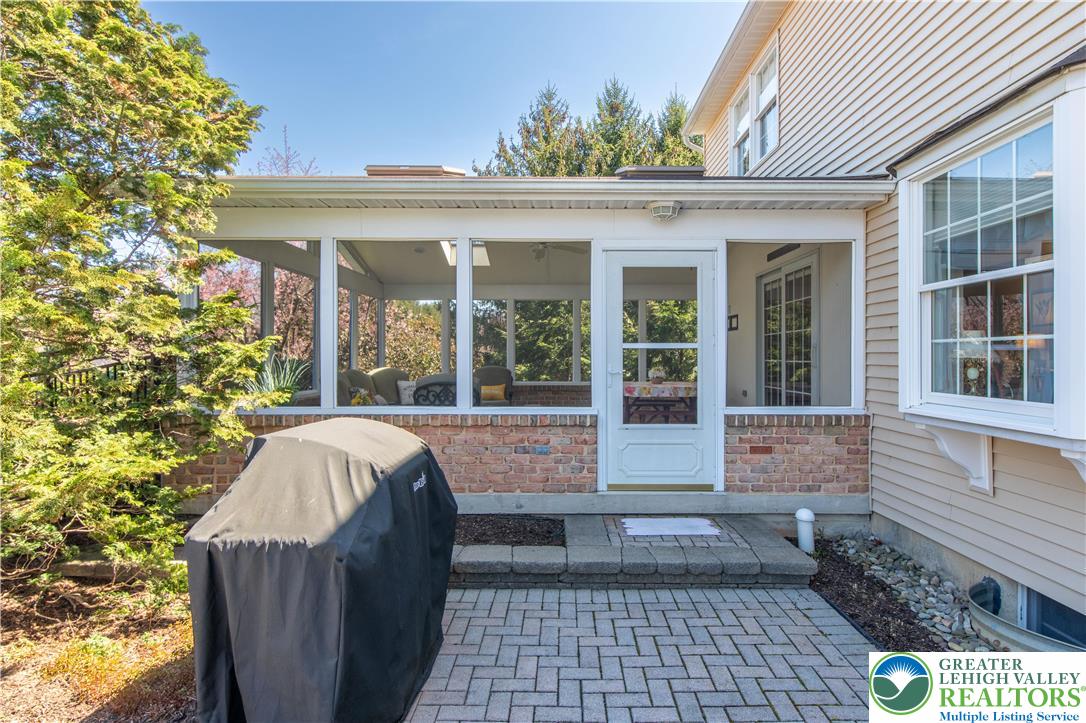 4059 Old Sentry Road Allentown, PA 18104 - Photo 32 of 39 A versatile screened porch provides a delightful outdoor living extension to this charming home.
