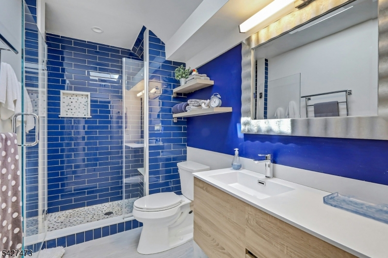 100 Easedale Road, Unit 100 Wayne, NJ 07470 - Photo 37 of 43 a bathroom with a sink a toilet and shower