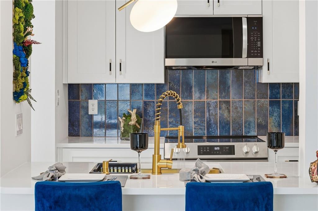 970 Sidney Marcus Boulevard Northeast, Unit 2203 Atlanta, GA 30324 - Photo 1 of 39 a view of living room with furniture and flat screen tv