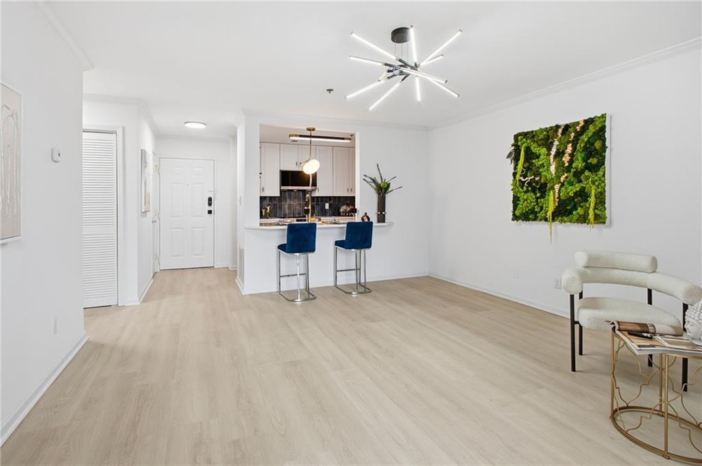 970 Sidney Marcus Boulevard Northeast, Unit 2203 Atlanta, GA 30324 - Photo 11 of 39 a view of work space with furniture and a potted plant