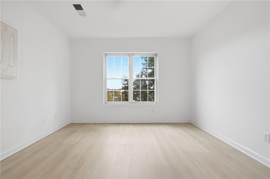 970 Sidney Marcus Boulevard Northeast, Unit 2203 Atlanta, GA 30324 - Photo 23 of 39 an empty room with a window