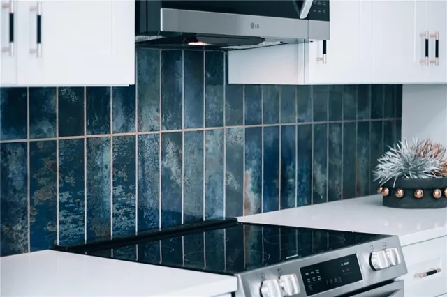 a kitchen that has a sink and a stove