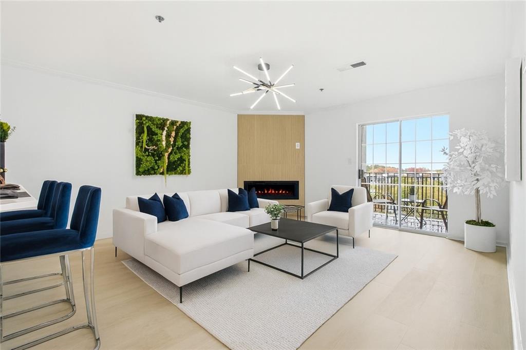 970 Sidney Marcus Boulevard Northeast, Unit 2203 Atlanta, GA 30324 - Photo 7 of 39 a living room with furniture and a large window