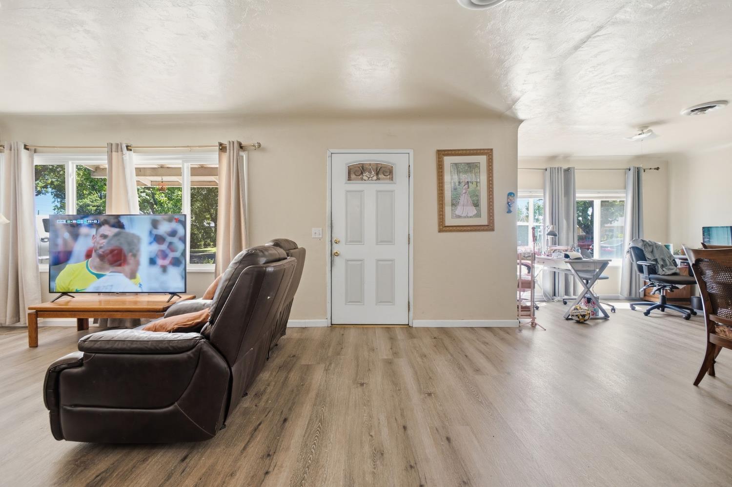 1705 Stetson Avenue Modesto, CA 95350 - Photo 5 of 32 a view of a livingroom with lounge chair and a large window