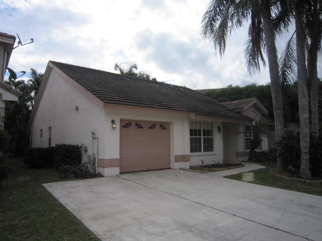 7408 Shell Ridge Terrace Lake Worth, FL 33467 - Photo 1 of 23 a view of a house with a backyard