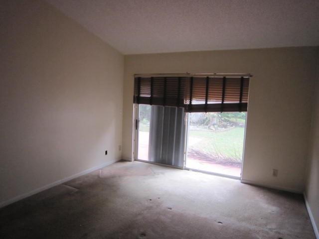 7408 Shell Ridge Terrace Lake Worth, FL 33467 - Photo 16 of 23 an empty room with windows