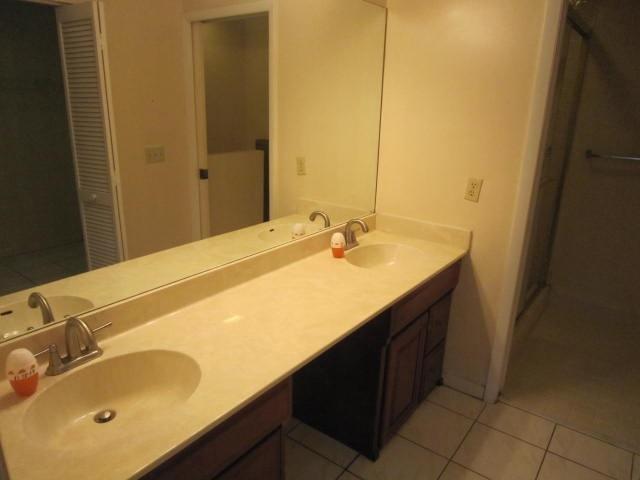 7408 Shell Ridge Terrace Lake Worth, FL 33467 - Photo 17 of 23 a bathroom with a sink and a mirror
