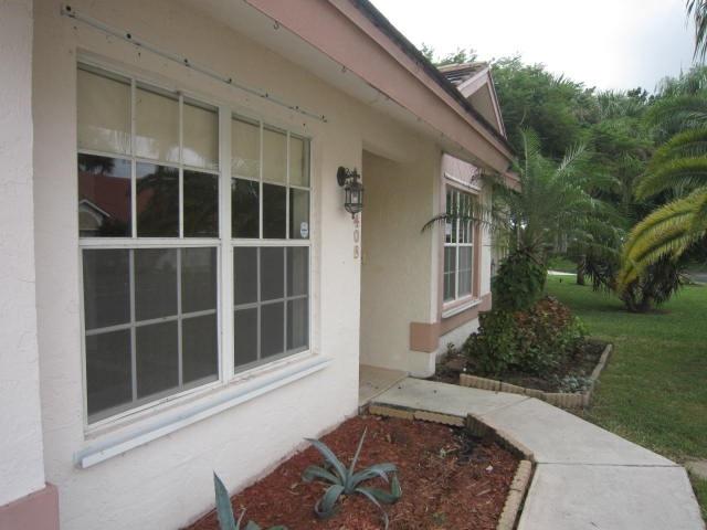 7408 Shell Ridge Terrace Lake Worth, FL 33467 - Photo 3 of 23 a view of house with backyard