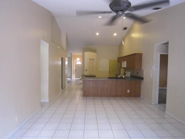 7408 Shell Ridge Terrace Lake Worth, FL 33467 - Photo 9 of 23 a view of a kitchen with a sink and a large window
