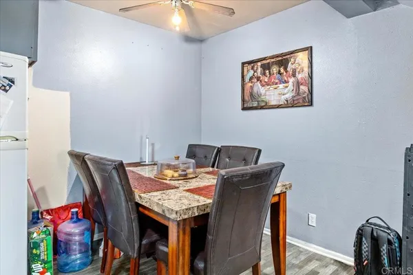 a kitchen with stainless steel appliances a stove a sink and a refrigerator