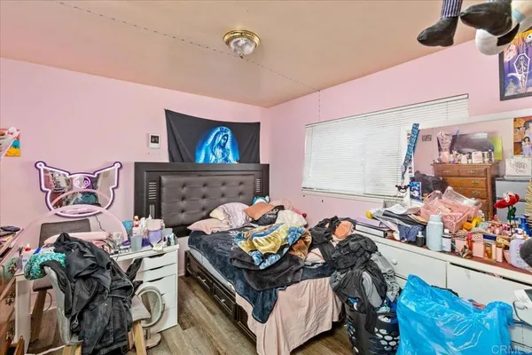 a bedroom with a bed and a couch