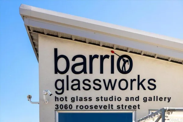 a front view of a building with parking space