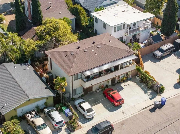 an aerial view of a house with outdoor space