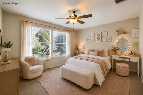 a bedroom with a bed and glass window