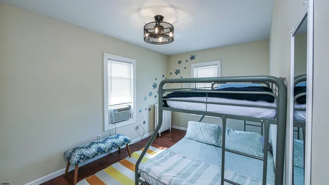 a bedroom with bed and a window