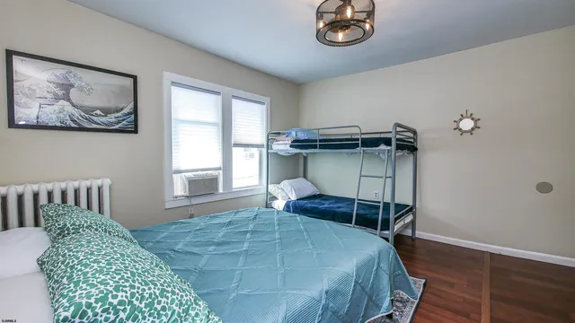 a bedroom with a bed and a chair