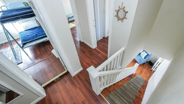 a view of entryway livingroom and hallway with wooden floor