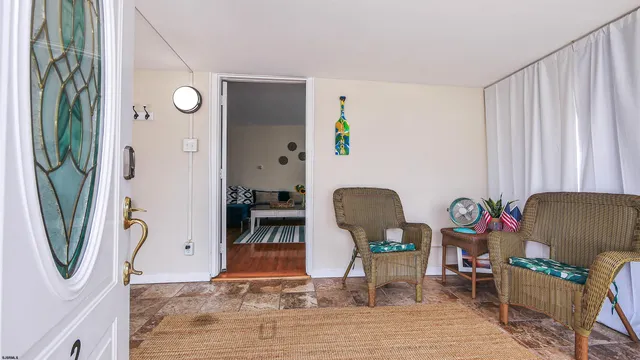 a view of living room with furniture and a window