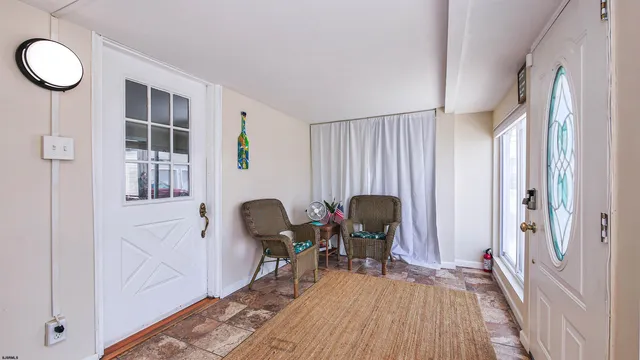 a view of a livingroom with furniture and wooden floor