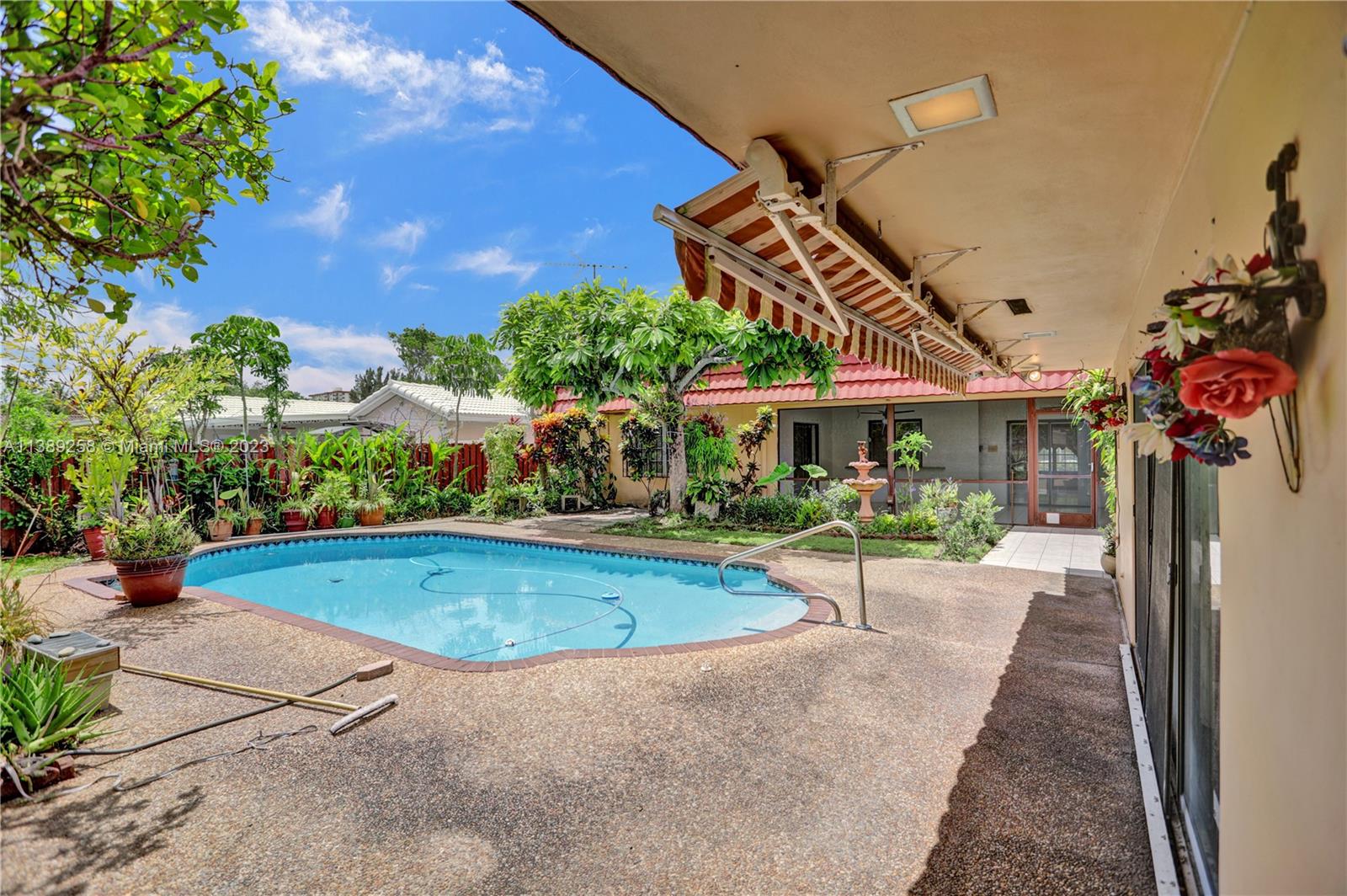 837 Washington Street Hollywood, FL 33019 - Photo 20 of 65 a view of a house with swimming pool and sitting area