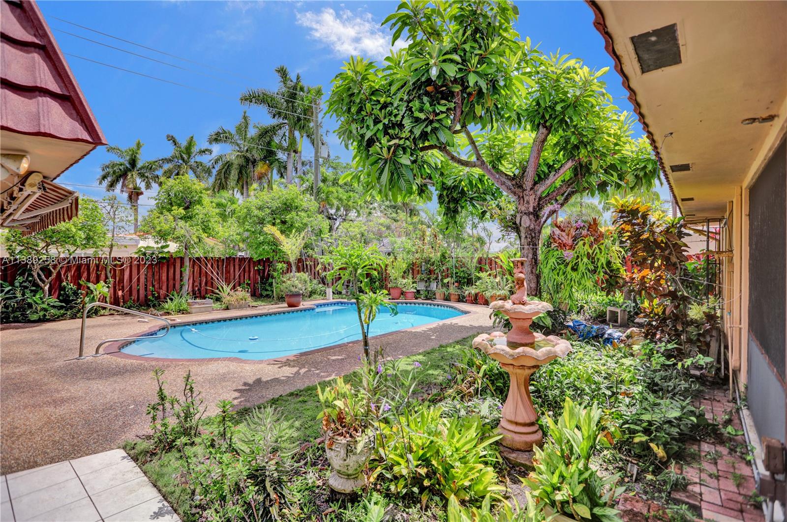 837 Washington Street Hollywood, FL 33019 - Photo 22 of 65 a view of a backyard with sitting area