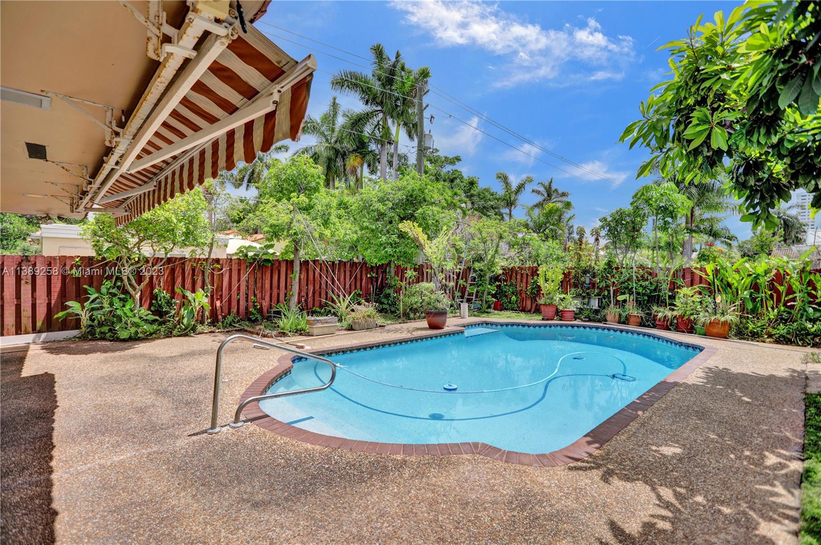 837 Washington Street Hollywood, FL 33019 - Photo 23 of 65 a view of a swimming pool with a patio