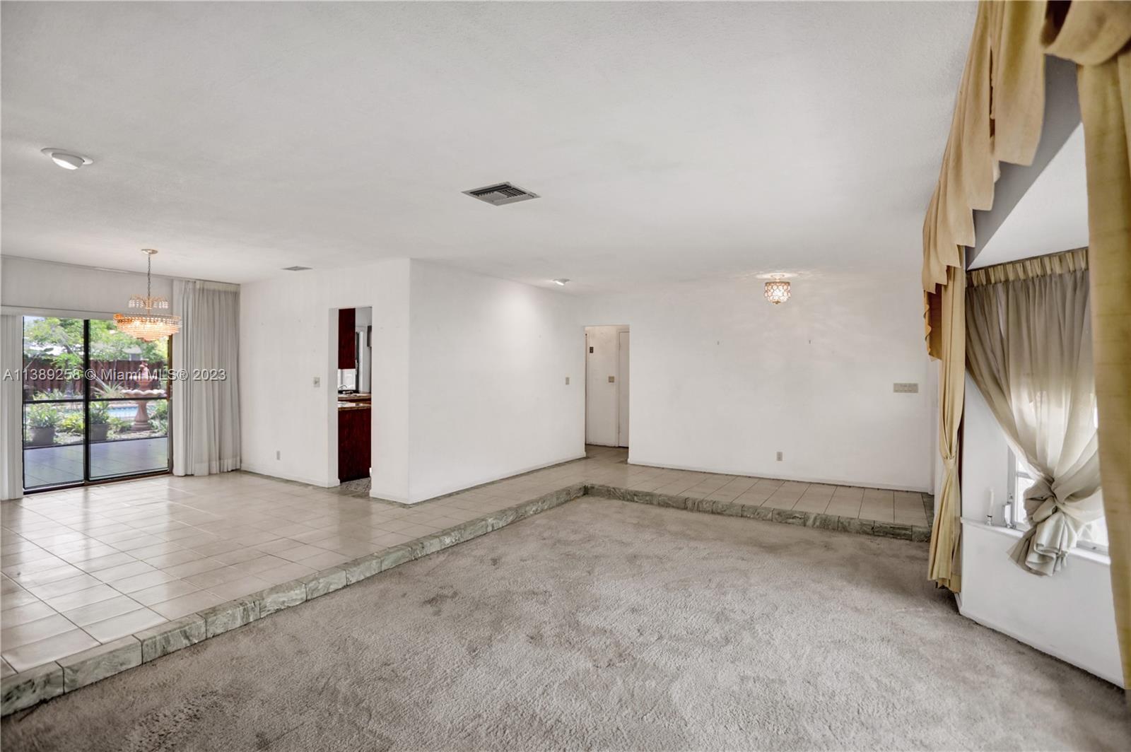 837 Washington Street Hollywood, FL 33019 - Photo 33 of 65 an empty room with entrance and windows