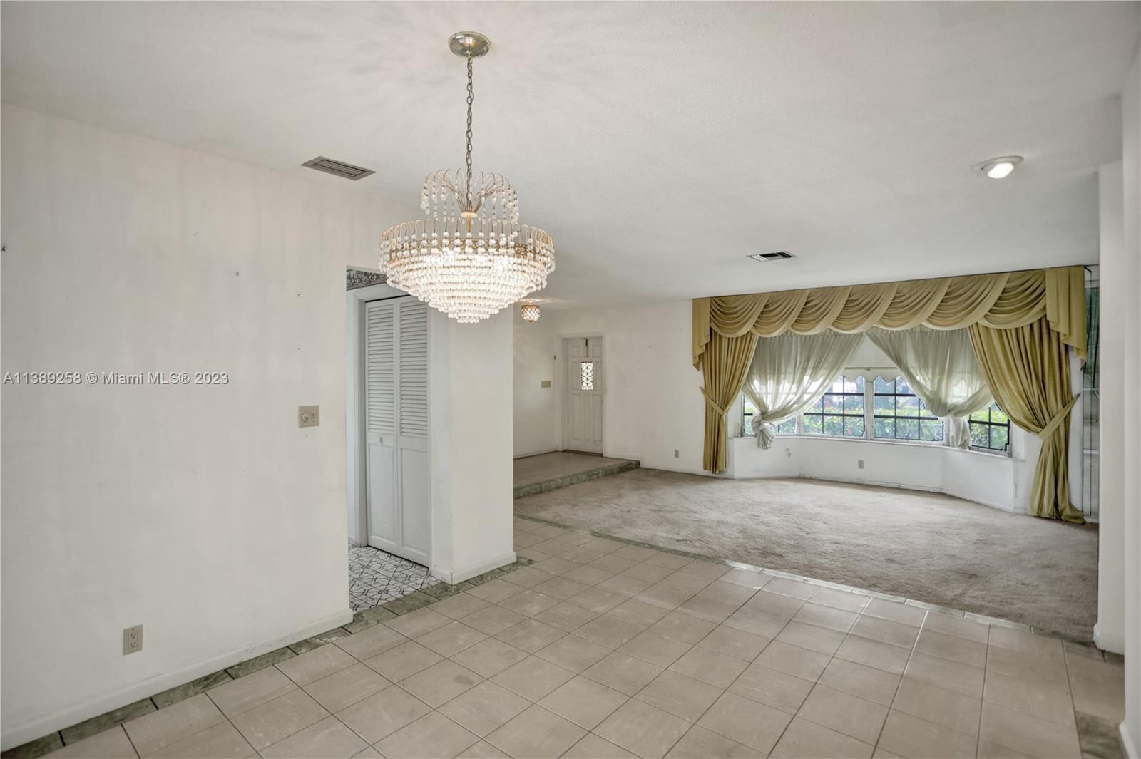 837 Washington Street Hollywood, FL 33019 - Photo 34 of 65 a view of livingroom with furniture and floor to ceiling window