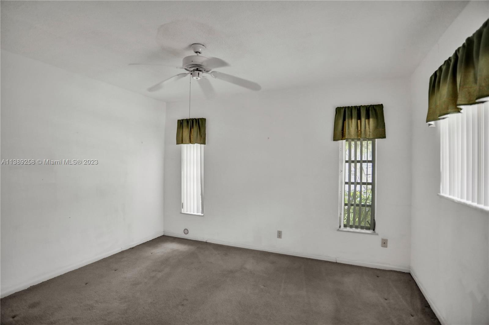 837 Washington Street Hollywood, FL 33019 - Photo 47 of 65 an empty room with windows and cabinet