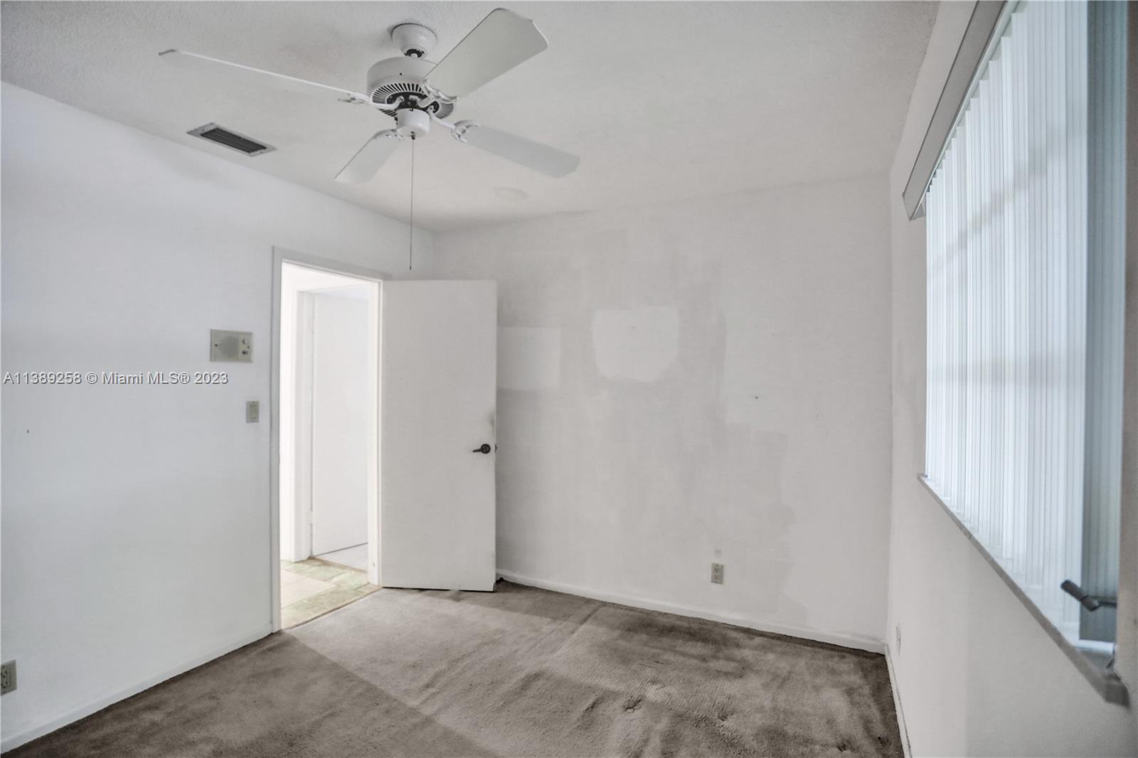 837 Washington Street Hollywood, FL 33019 - Photo 50 of 65 a view of an empty room with a window