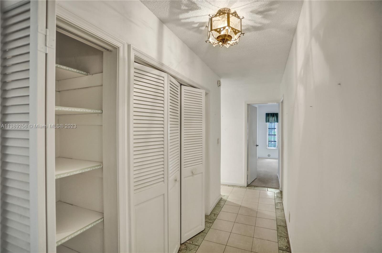 837 Washington Street Hollywood, FL 33019 - Photo 53 of 65 a view of a hallway with a bathroom