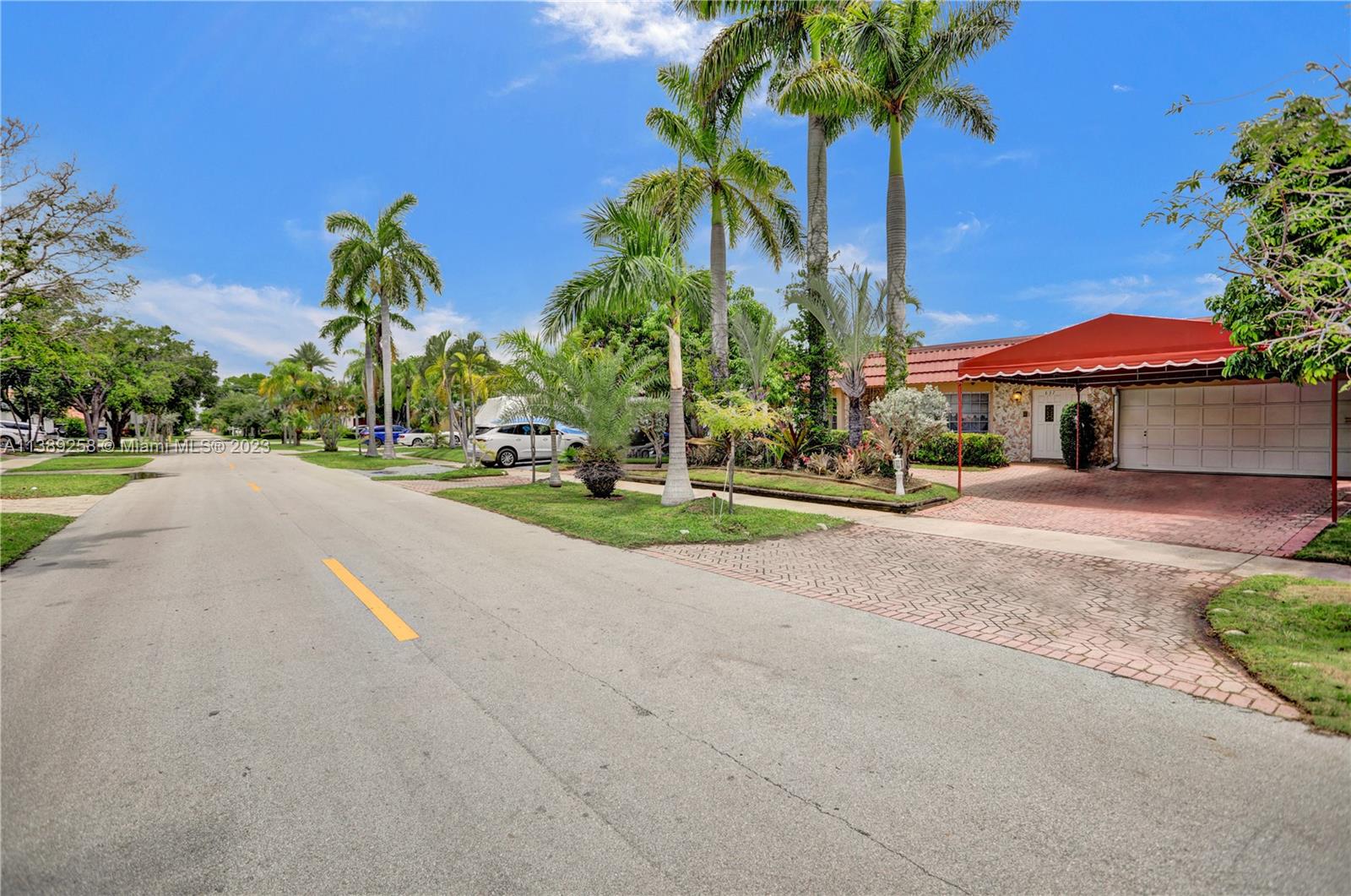 837 Washington Street Hollywood, FL 33019 - Photo 64 of 65 a view of a street with palm trees