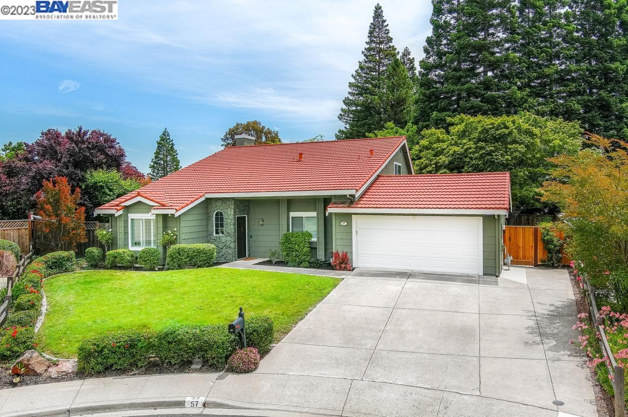 a view of house with yard