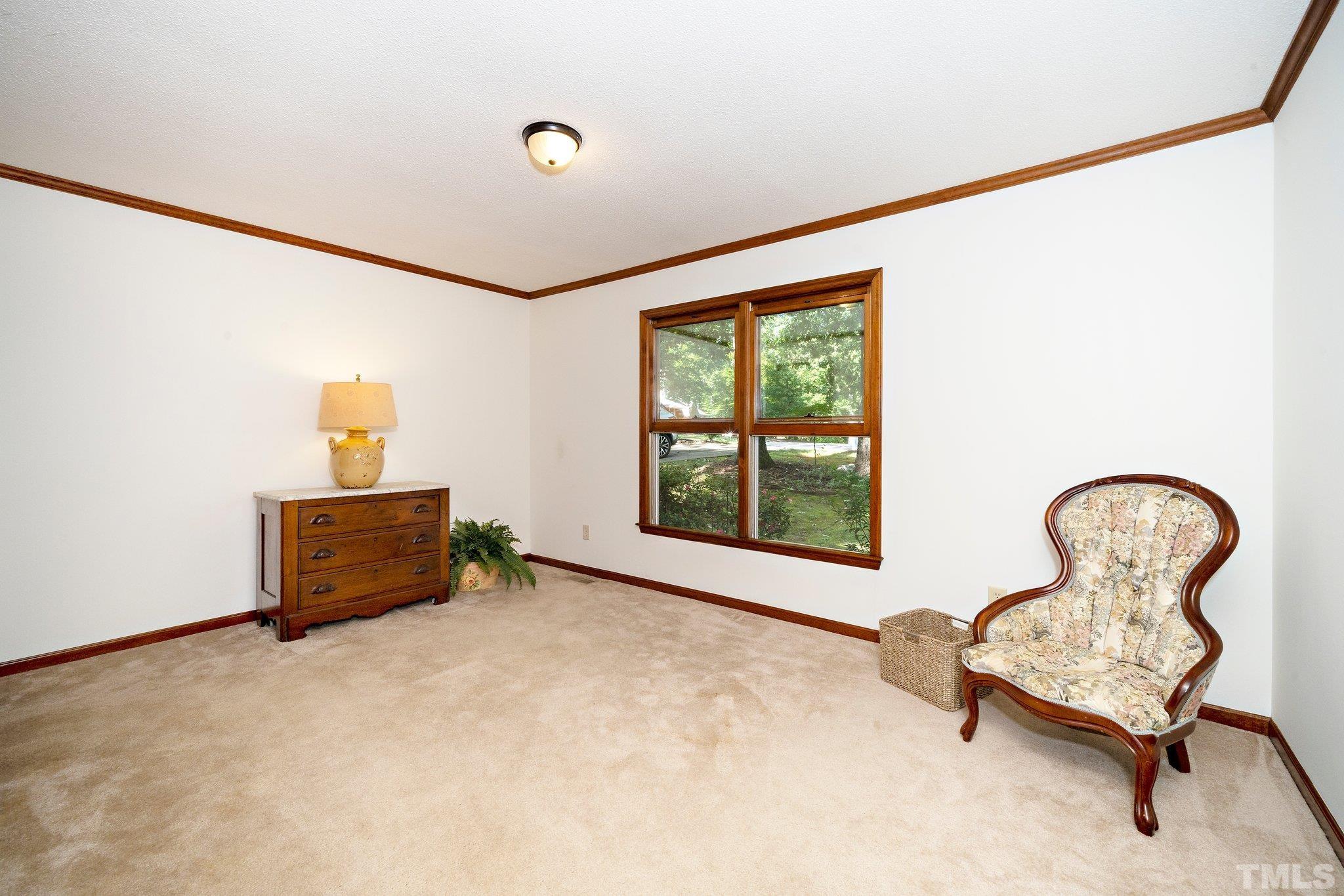 902 Bridge Way Raleigh, NC 27615 - Photo 13 of 27 a room with furniture and window