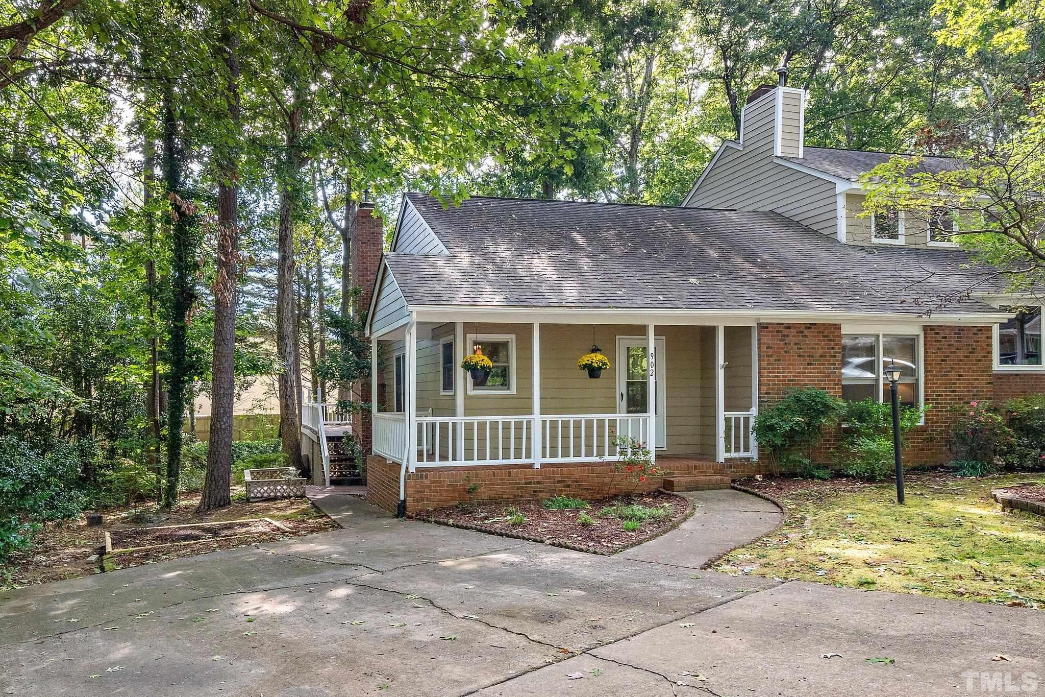 902 Bridge Way Raleigh, NC 27615 - Photo 2 of 27 a front view of a house with a garden and porch