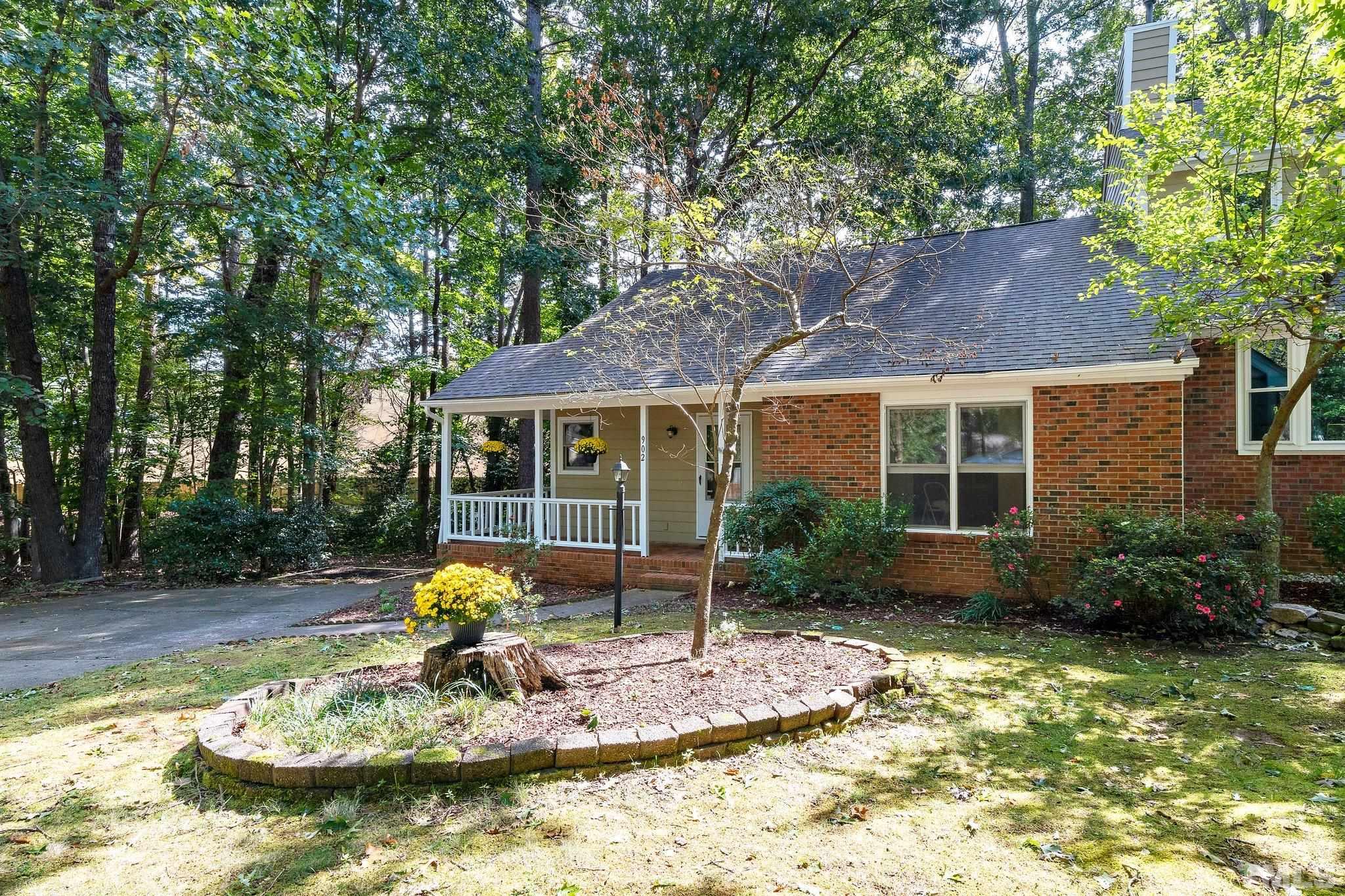 902 Bridge Way Raleigh, NC 27615 - Photo 3 of 27 a front view of a house with garden