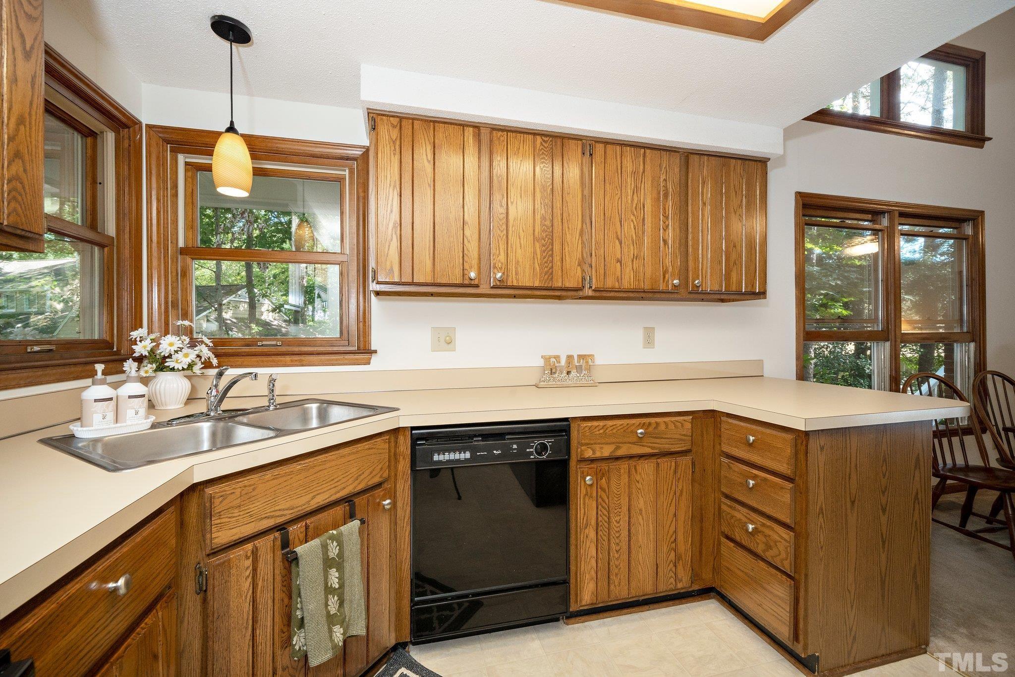 902 Bridge Way Raleigh, NC 27615 - Photo 7 of 27 a kitchen with a sink stove and cabinets
