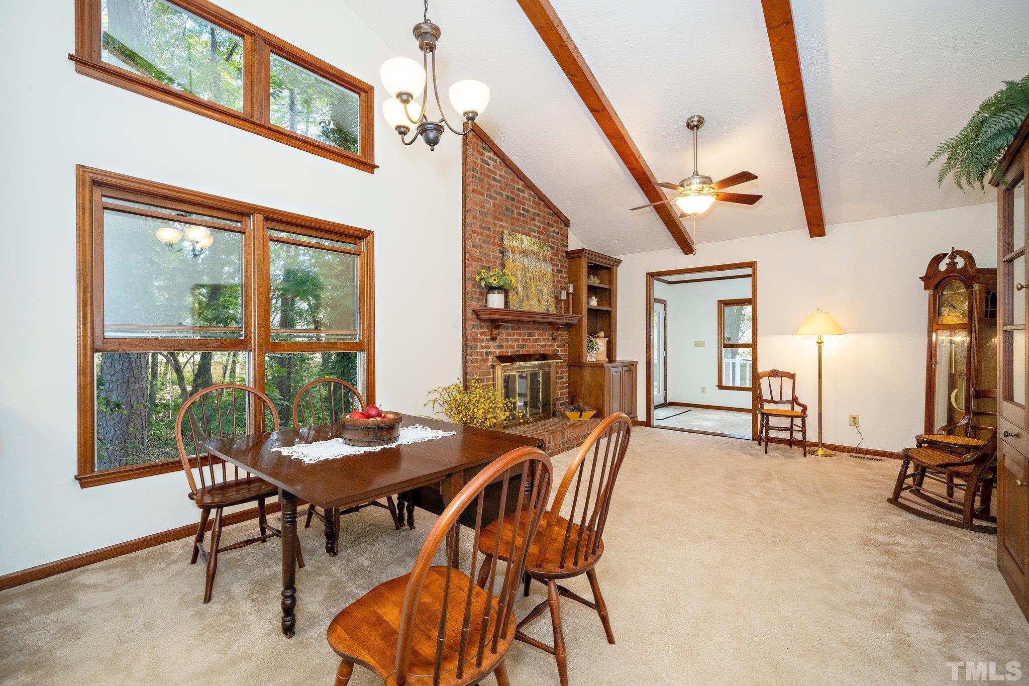 902 Bridge Way Raleigh, NC 27615 - Photo 10 of 27 a dining room with furniture and a floor to ceiling window