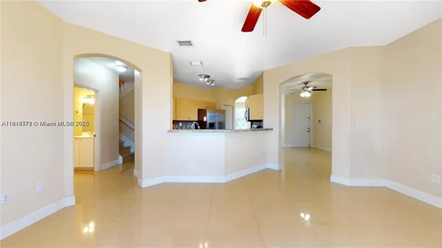 a bathroom with a glass shower door and a toilet