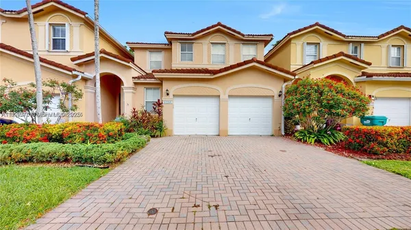 an empty room with closet and windows