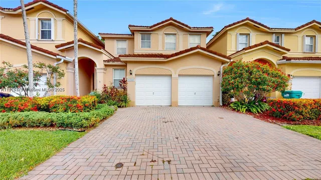 an empty room with ceiling fan and window
