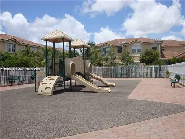 a view of a yard with basketball court