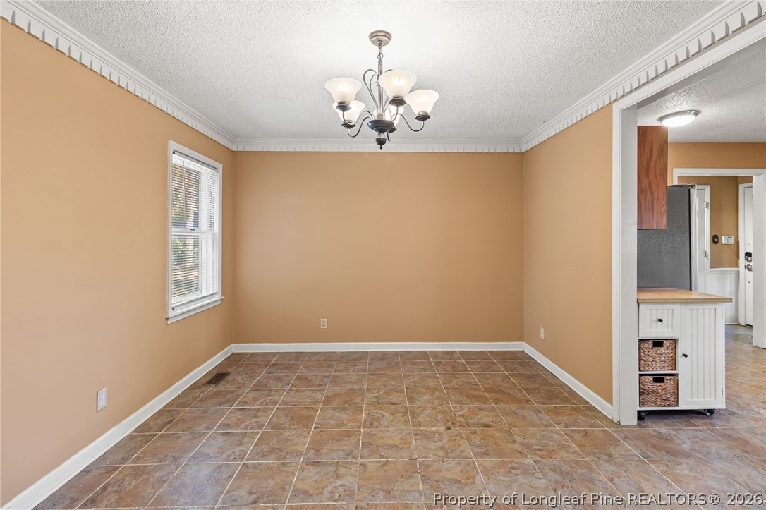 5605 MacGregor Court Fayetteville, NC 28304 - Photo 11 of 49 a view of an empty room with window