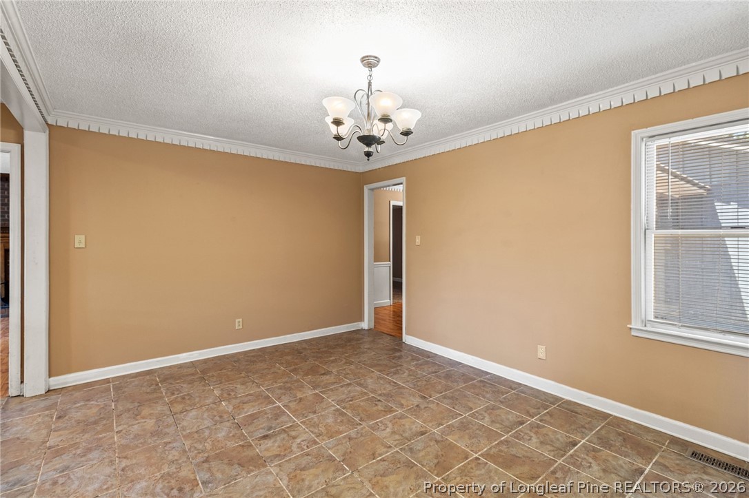 5605 MacGregor Court Fayetteville, NC 28304 - Photo 12 of 49 a view of an empty room with a window