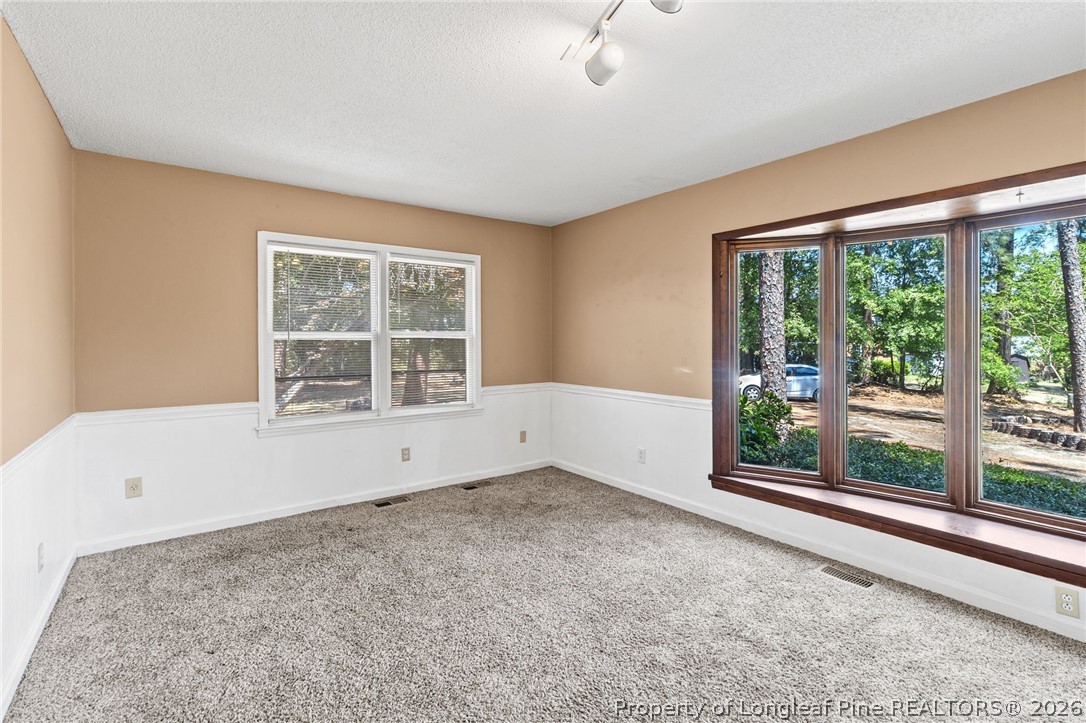 5605 MacGregor Court Fayetteville, NC 28304 - Photo 22 of 49 an empty room with windows