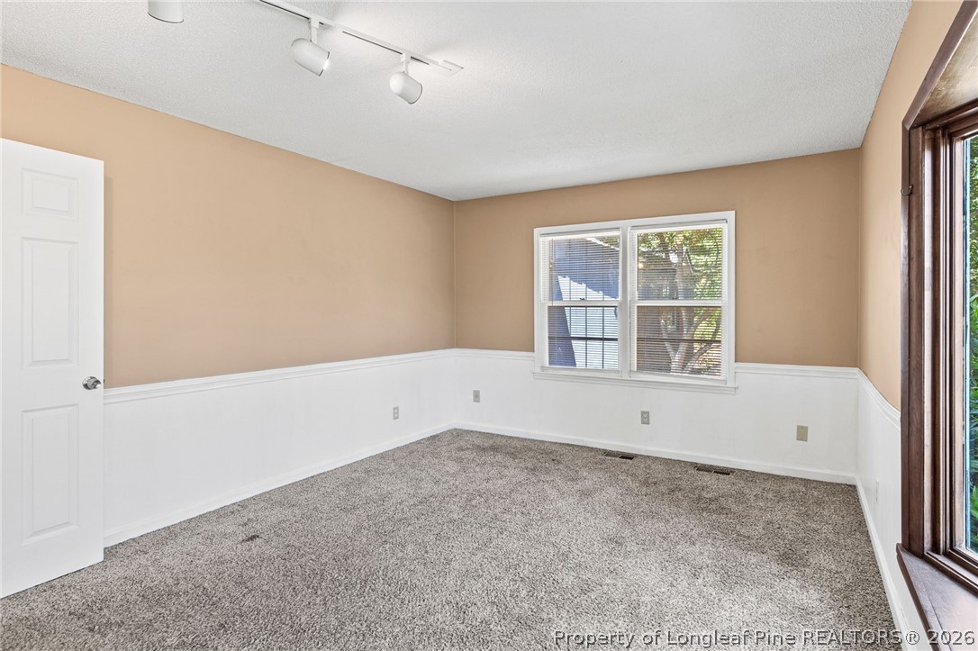 5605 MacGregor Court Fayetteville, NC 28304 - Photo 24 of 49 an empty room with windows