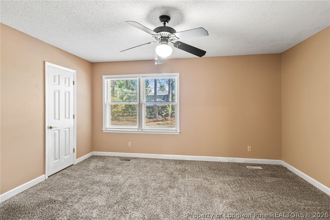 5605 MacGregor Court Fayetteville, NC 28304 - Photo 27 of 49 a view of an empty room with a window