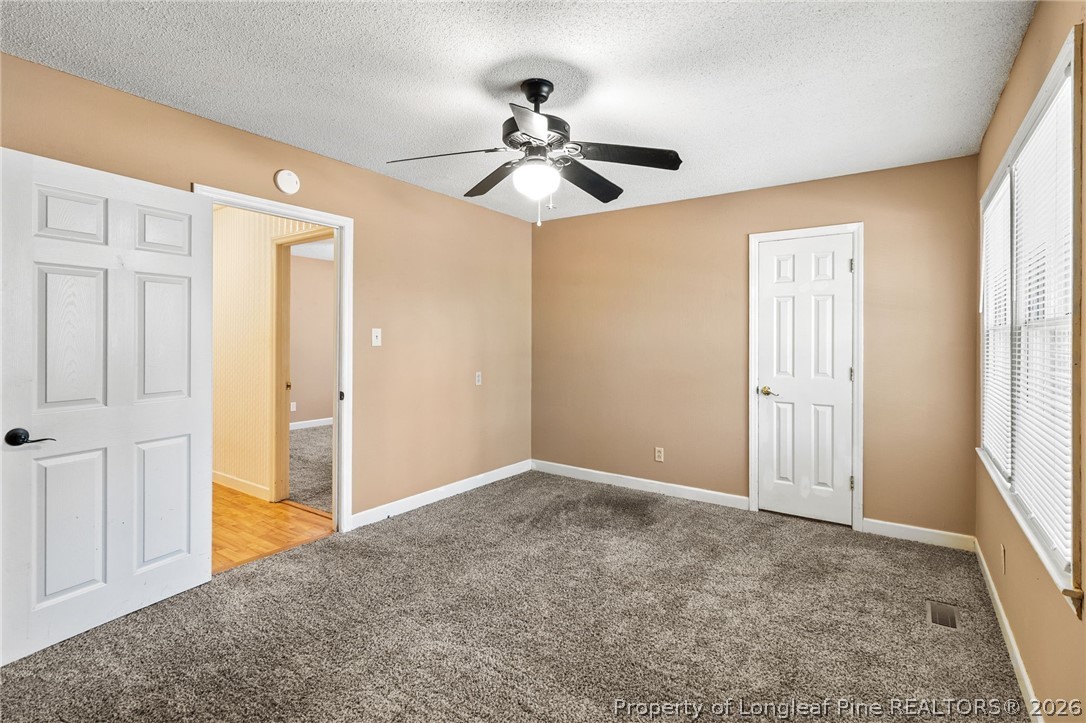 5605 MacGregor Court Fayetteville, NC 28304 - Photo 28 of 49 wooden floor in an empty room with a window